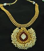 Stunning Maroon colour Gold Plated Necklace set studded with American Diamond stones