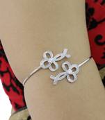Silver tone bow armlet
