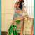 green and cream embroidered net saree with blouse