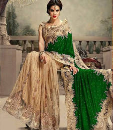 green embroidered net saree with blouse
