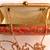 Red clutches embroidered