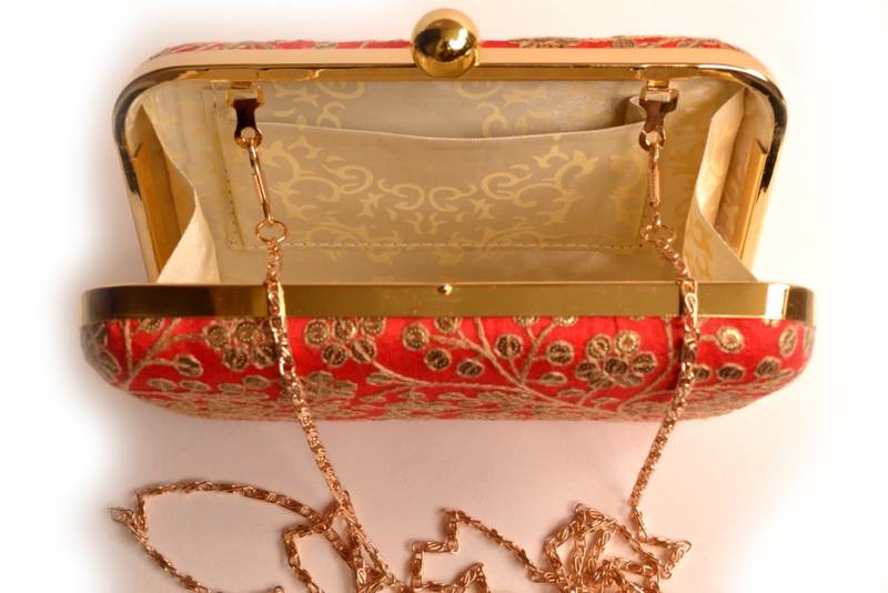 Red clutches embroidered