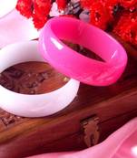 pink and white plastic bangles