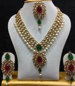 Dazzling Kundan Set in Red and Green with Pearls