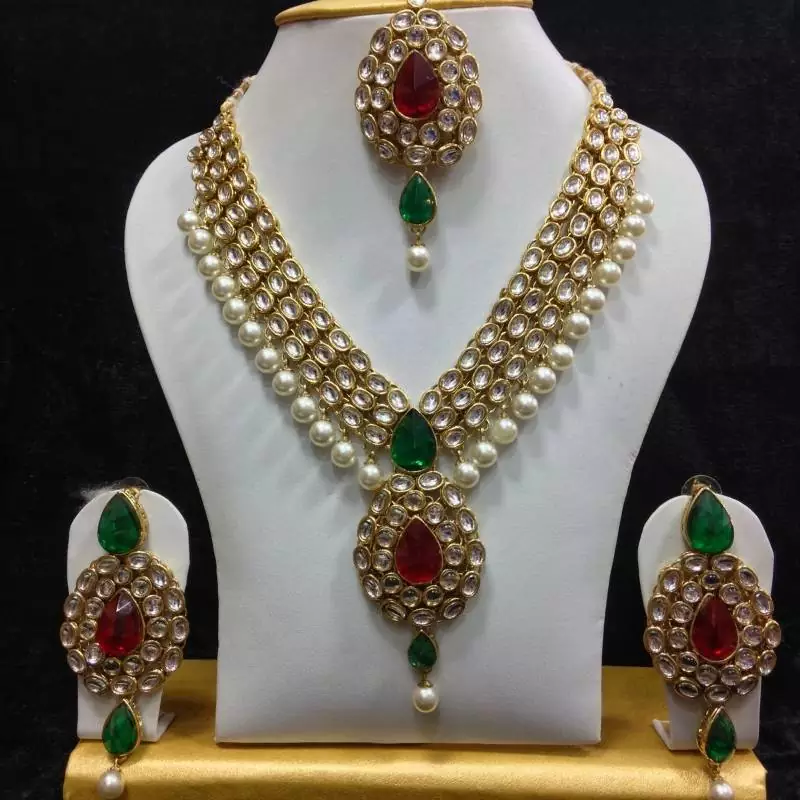 Dazzling Kundan Set in Red and Green with Pearls