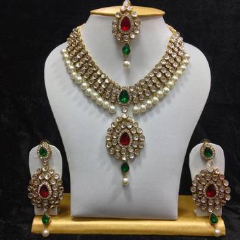 Dazzling kundan set in Red and Green Stones and Pearls 1