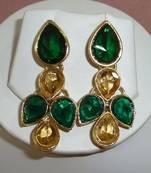 Beige n green ear ring.