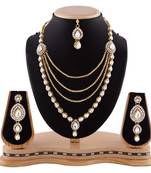 Auatrian Stone Four Layer Gold Finishing Party Wear Necklace Set With Maang Tikka