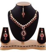 Maroon Austrian Stone Party Wear Gold Finishing Necklace Set With Maang Tikka