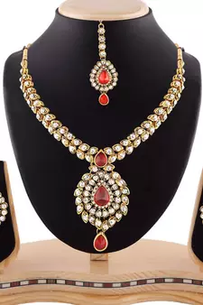 Red Austrian Stone Exclusive Design Gold Finishing Necklace Set With Maang Tikka