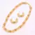 Traditional and elegant gold plated pearl necklace set