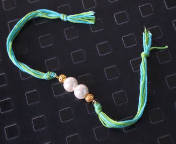 Turquoise And Green Pearl Rakhi 1