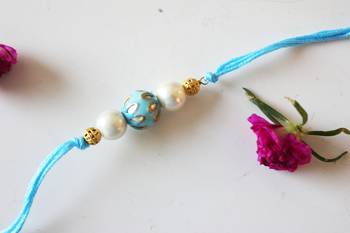 Turquoise Meenakari Kundan Work And Pearl Rakhi 1