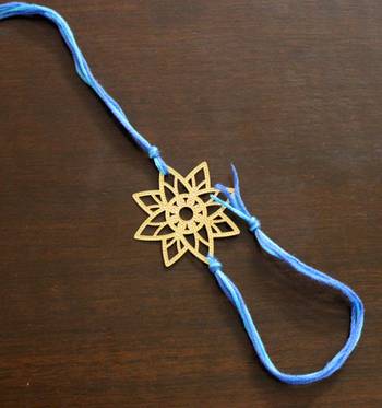 Blue And Gold Filigree Star Rakhi 1