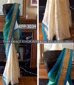 Cream And Aqua Green Embroidered Net Saree With Blouse