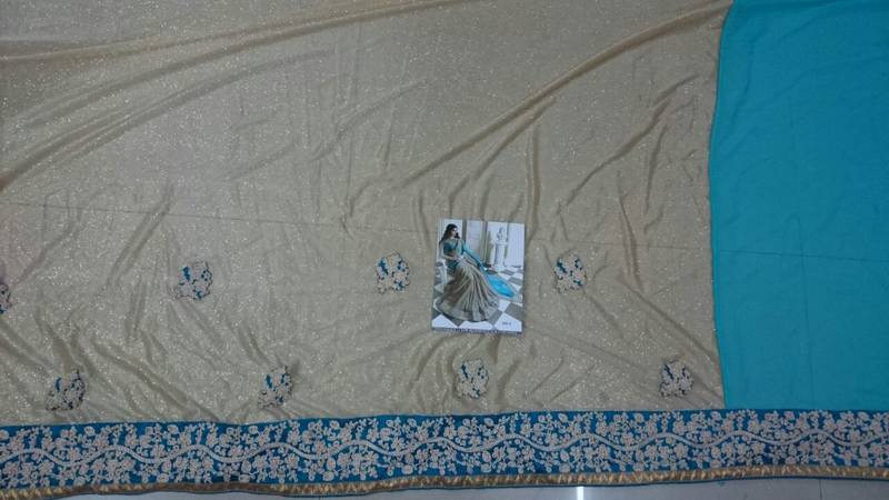 Cream And Cyan Embroidered Georgette Saree With Blouse