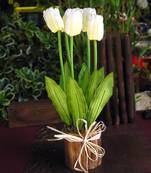 White Artificial Tulips on a Round Wooden Vase