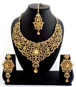 Designer golden stone bridal necklace set with maang tikka