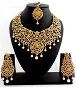 Designer golden stone bridal necklace set with maang tikka