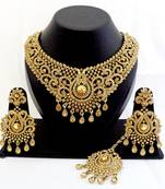 Designer golden stone wedding necklace set with maang tikka