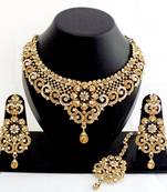Designer golden white stone wedding necklace set with maang tikka