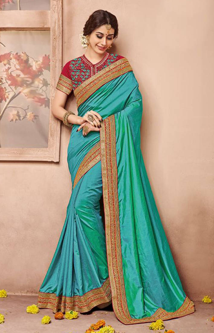 Dark sea green embroidered art silk saree with blouse