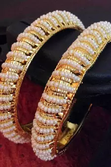 Pair of really glowing golden pear bangles q9