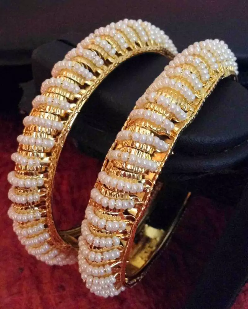Pair of really glowing golden pear bangles q9
