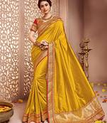 Dark yellow embroidered banglori silk saree with blouse
