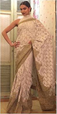 Beige embroidered net saree with blouse 1