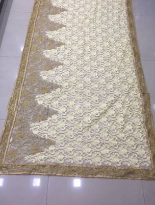 Beige embroidered net saree with blouse 2