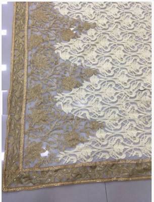 Beige embroidered net saree with blouse 3