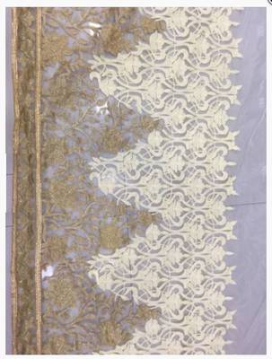 Beige embroidered net saree with blouse 4