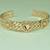 Triple Heart Embossed Cuff Bangle In Rose Golden Tone Metal With Double Interwined Wave Pattern Bracelets