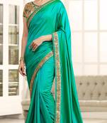 Cyan Embroidered Georgette Saree With Blouse