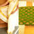 Off-white kerala kasavu saree with green brocade blouse piece