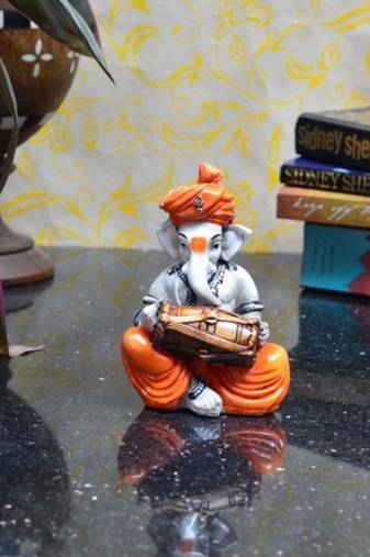 Lord Ganesha playing Dholak