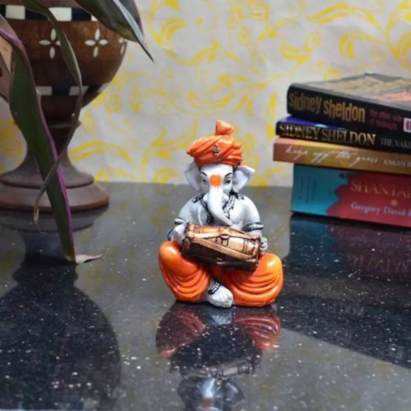 Lord Ganesha playing Dholak