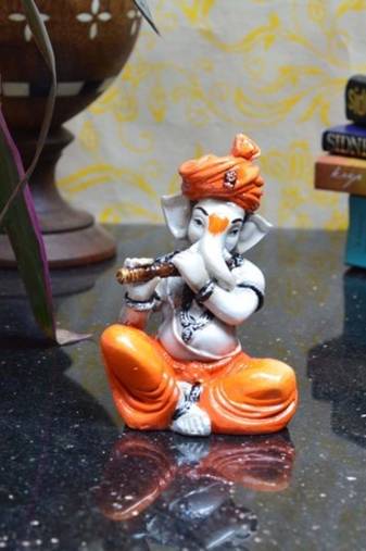 Lord Ganesha playing Flute