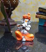 Lord Ganesha playing Flute