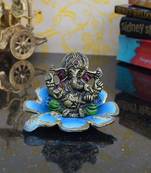 Metal Ganesha Figurine on Decorative Sky Blue Leaf