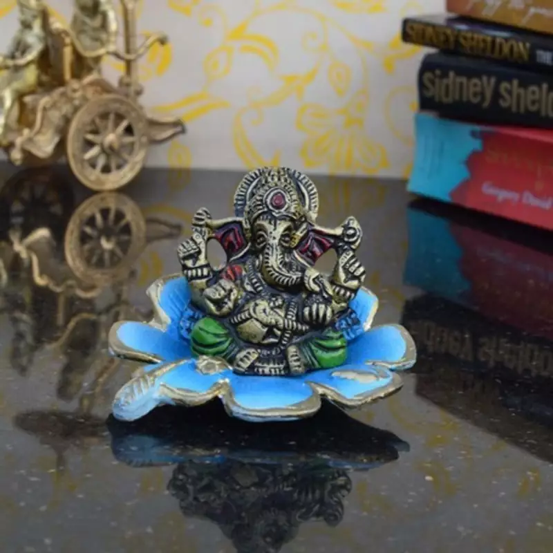 Metal Lord Ganesha Statue on Sky Blue Leaf