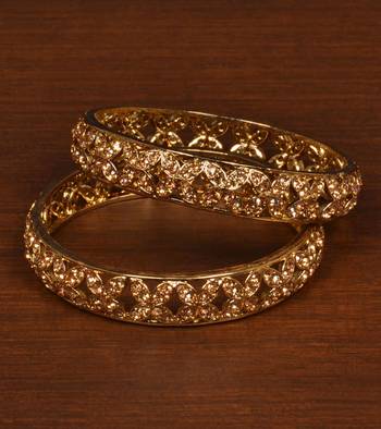 Gold plated gheru stone embellished copper made  bangles 1