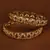 Gold plated gheru stone embellished copper made  bangles