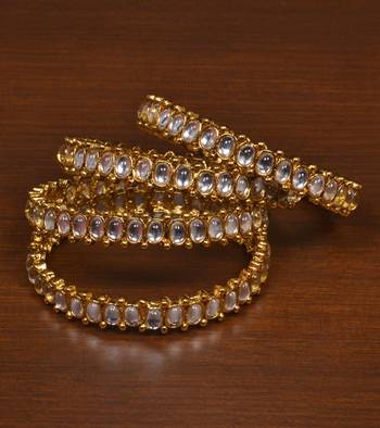 Gold plated gheru stone embellished copper made  bangles 1