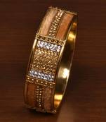 Gold plated feather and zircon embellished bracelet