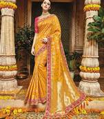 Yellow embroidered banarasi silk saree with blouse