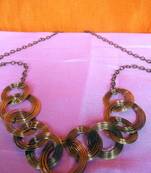 multi circled dull gold necklace