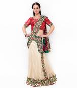 Beige Embroidered Net Saree With Blouse