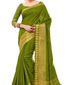 Sudarshan silk Green woven raw silk saree with blouse